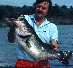 Larry  Larsen with giant largemouth bass
